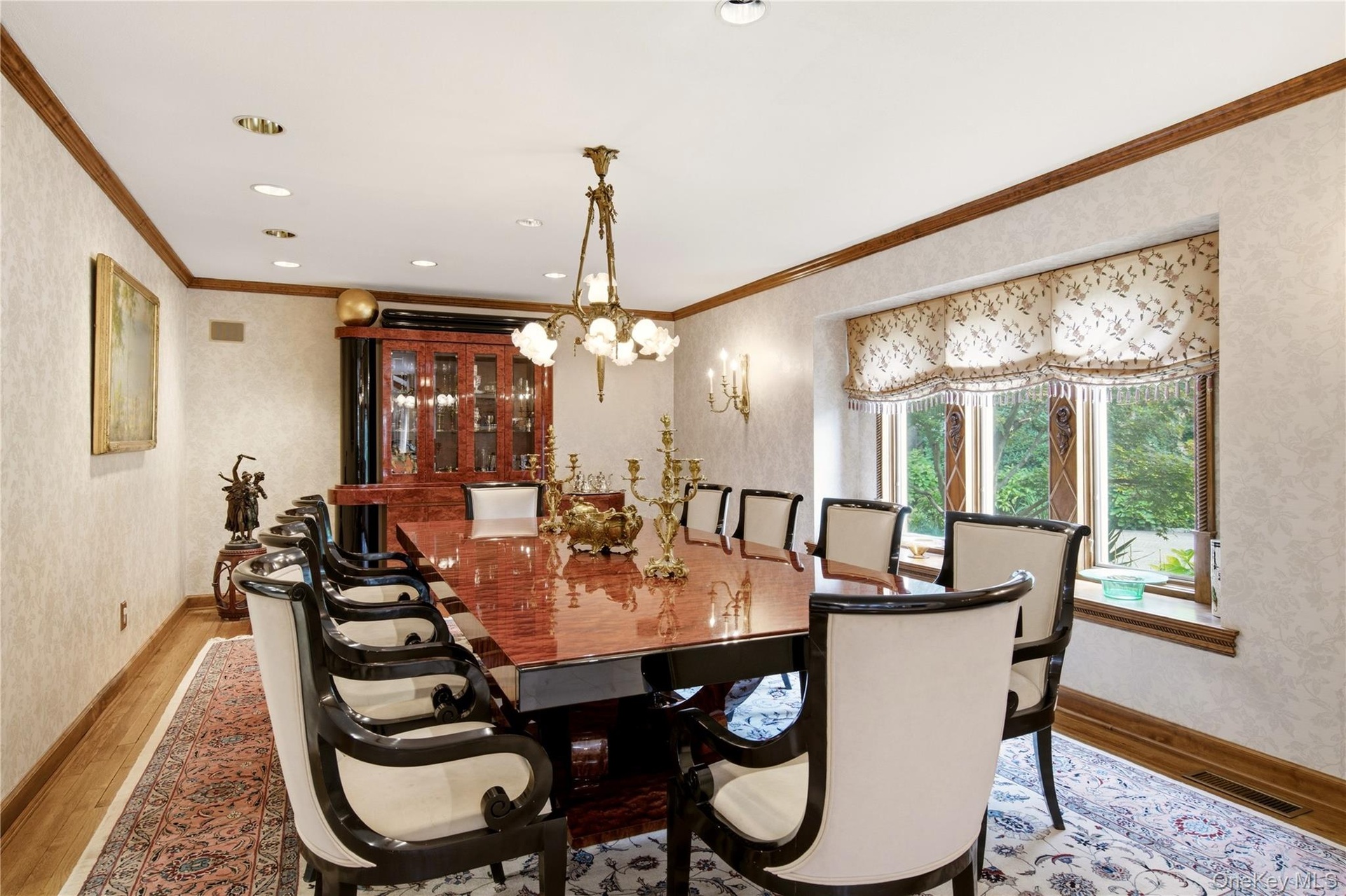 Banquet size dining room, with recessed lighting, wood-finish flooring, and crown molding
