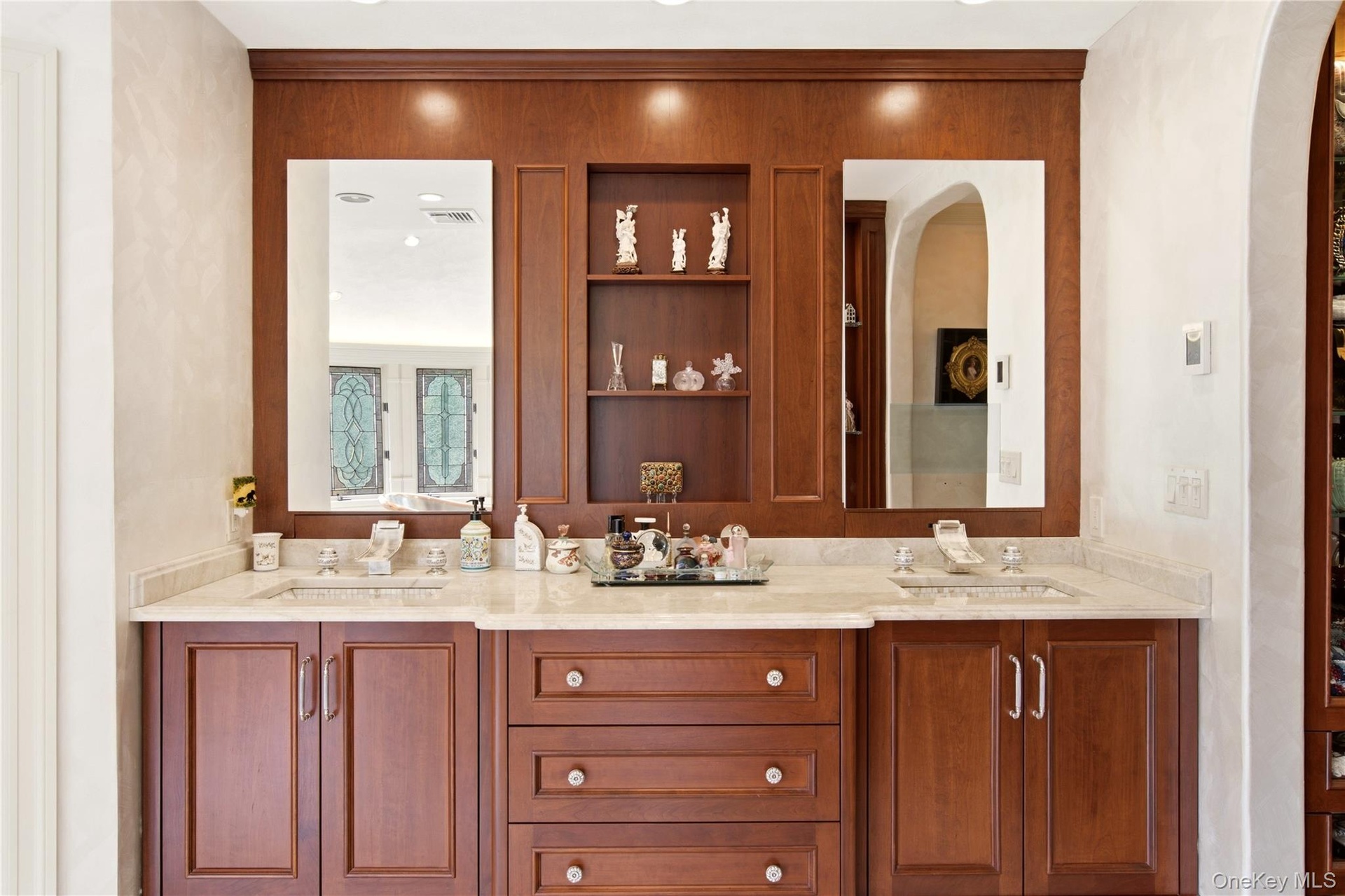 French Provincial -style vanity, with duel sinks and integrated shelving