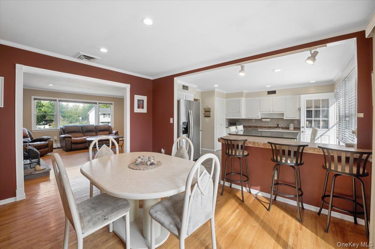 The dining room opens to the living room and kitchen, creating an easy flow for entertaining.