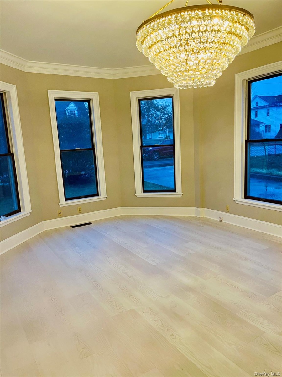 Light wood-finish flooring with crisp white trim