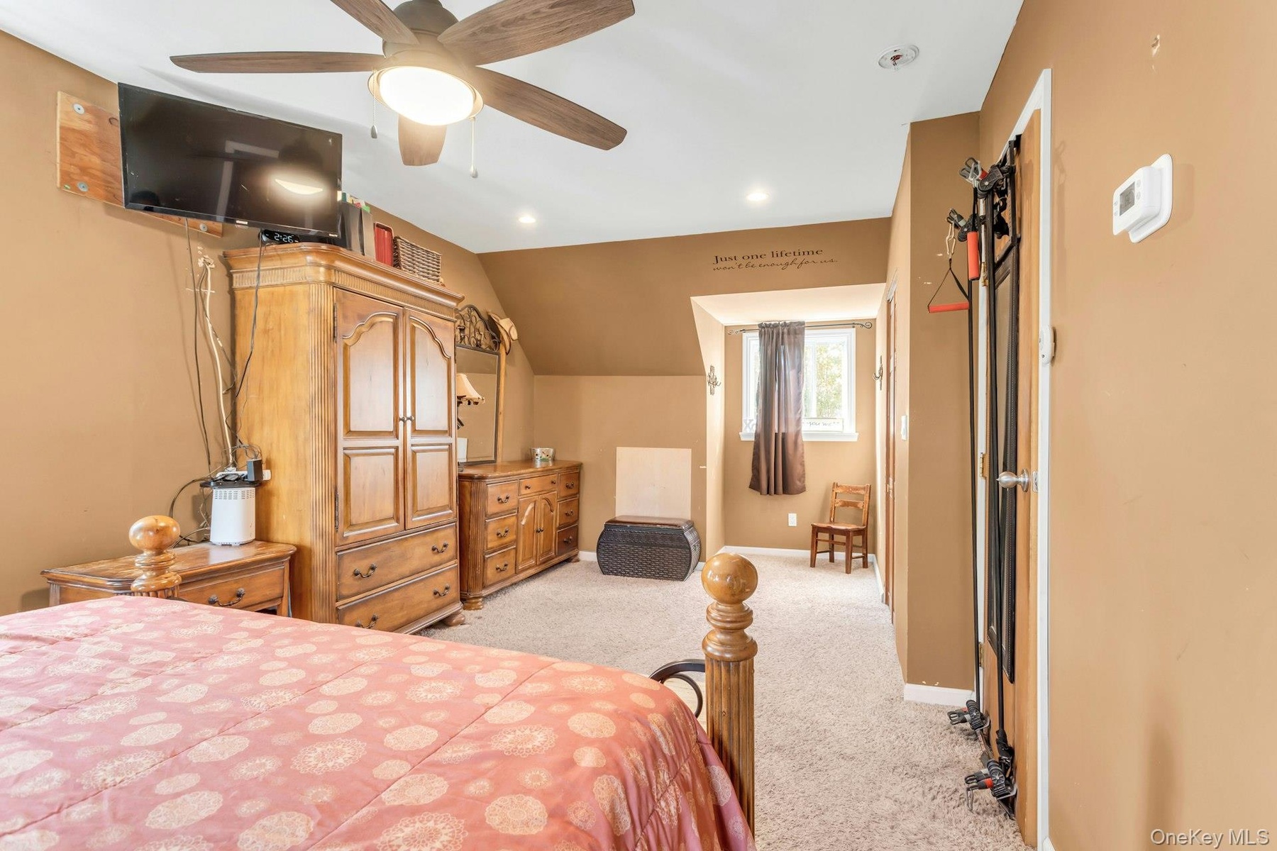Tray ceiling with recessed lighting and a ceiling fan