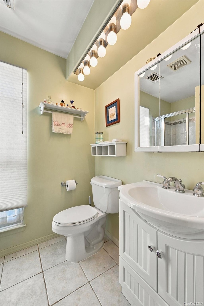 The Primary Bathroom Offers An Oversized Step In Shower With  Updated Beautiful Ceramic Tile Walls/Surround, Accent Border/Trim, An Updated Vanity & C