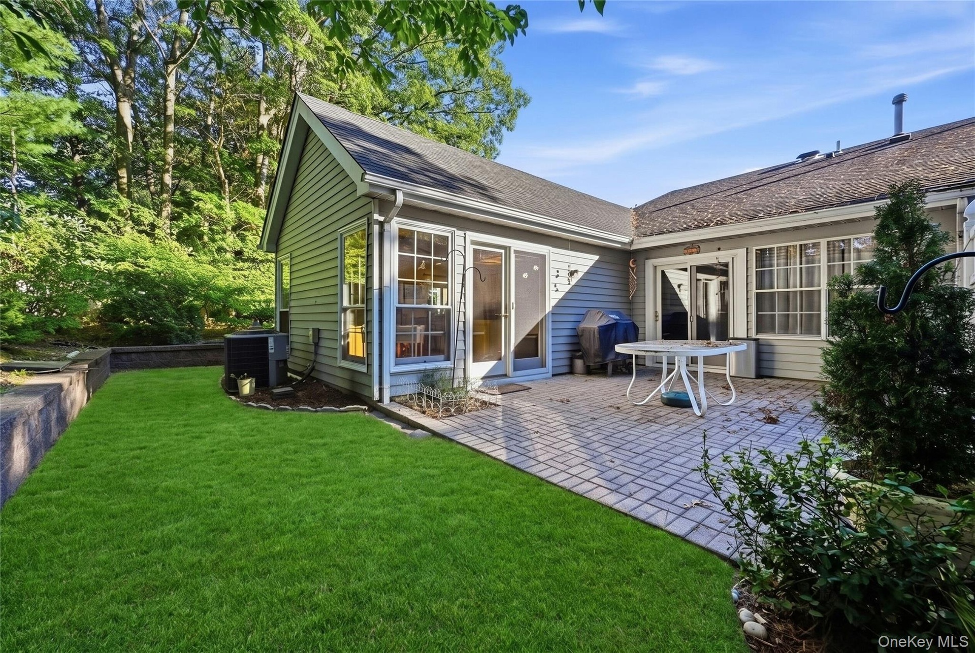 The Very Private Backyard Offers A Large Brick/Paver Patio With PVC Privacy Fencing And  A Stone Wall Accentuates The Mature Landscape & Privacy/Shade