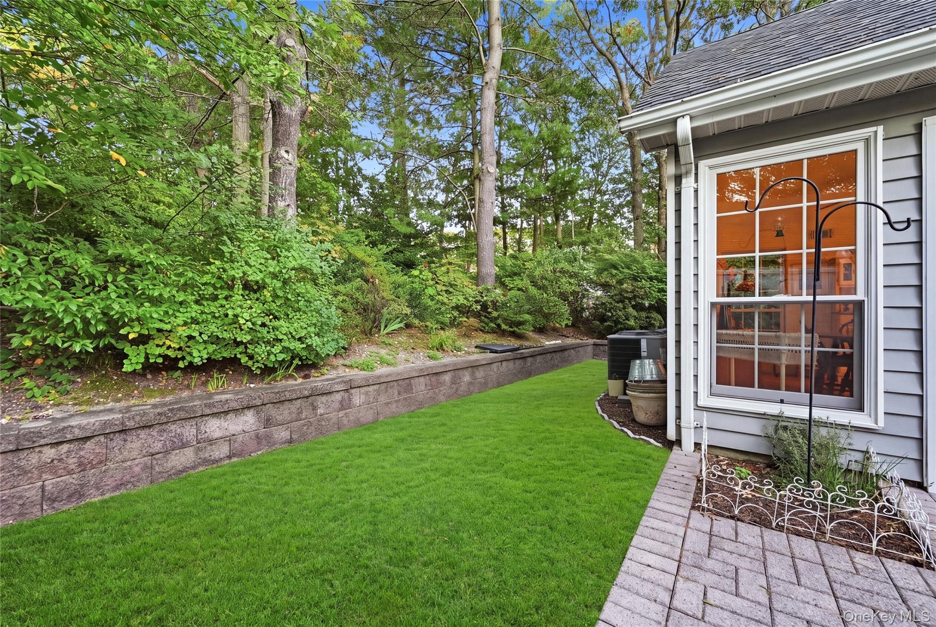 The Home Offers A Very Private Backyard With Beautiful Landscape, Accent Stone Walls & Tall Privacy/Shade Trees