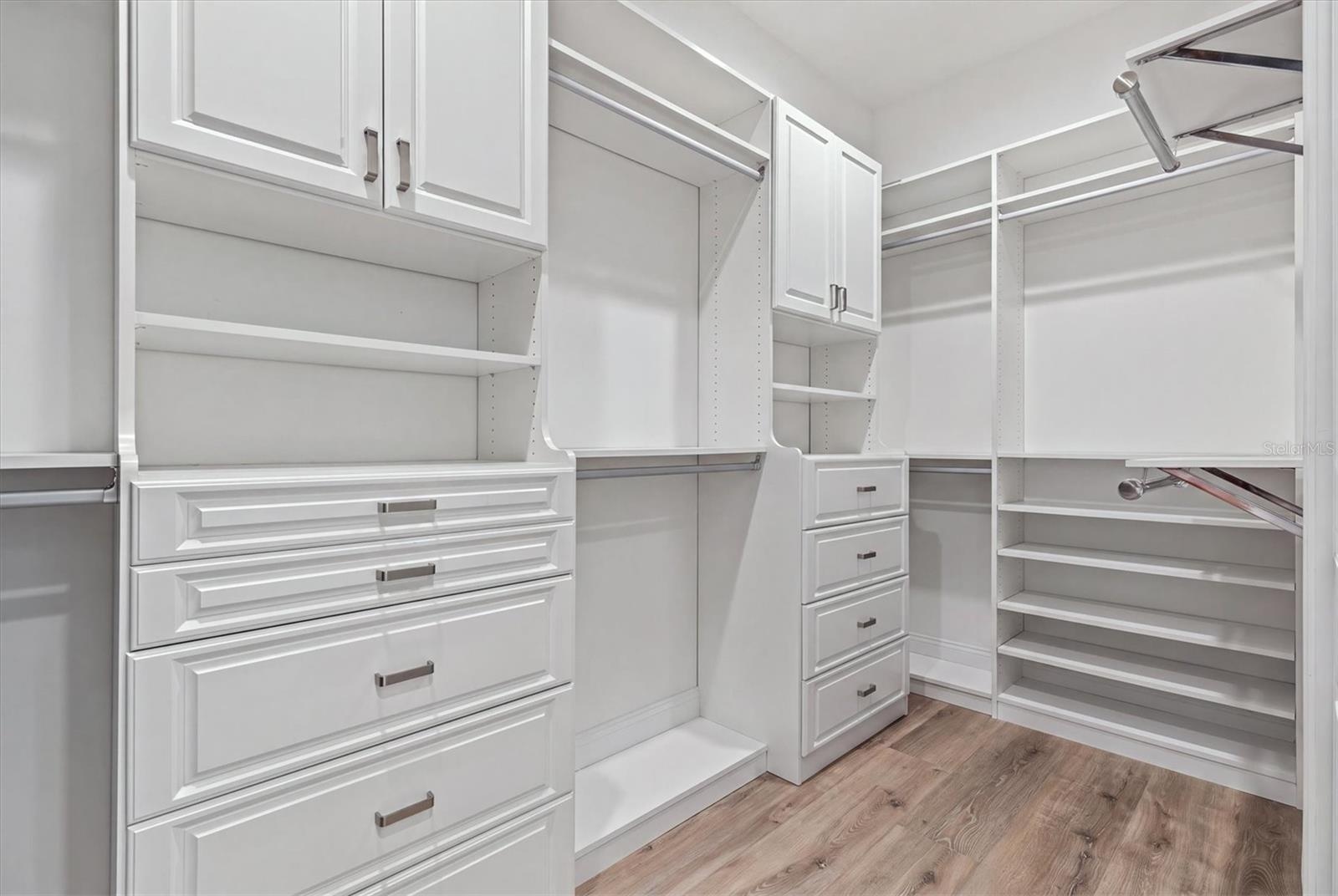 Primary Bedroom Walk in Closet with built ins