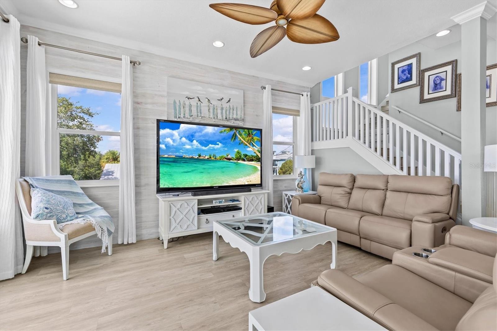 Living Room with Crown Molding & Remote
