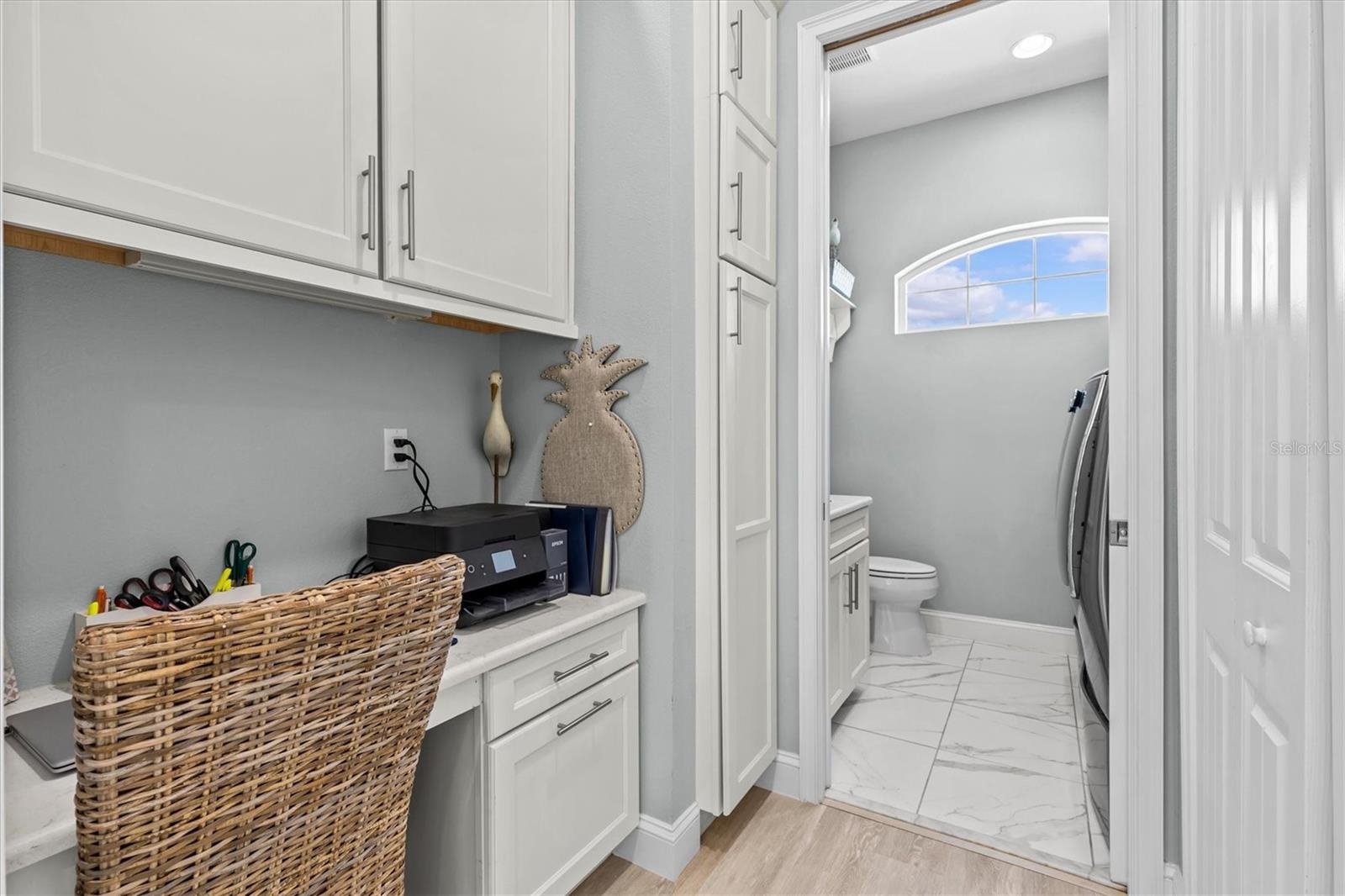 Built in Desk Next to Kitchen.. Leads into half bath/laundry room