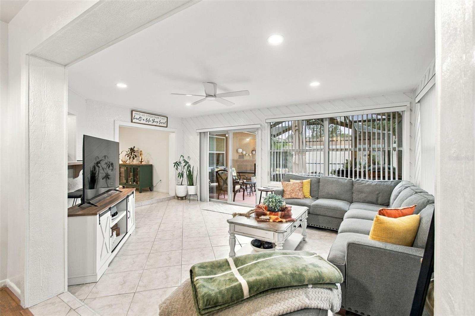 OPEN CONCEPT LEADS TO SCREENED POOL LANAI
