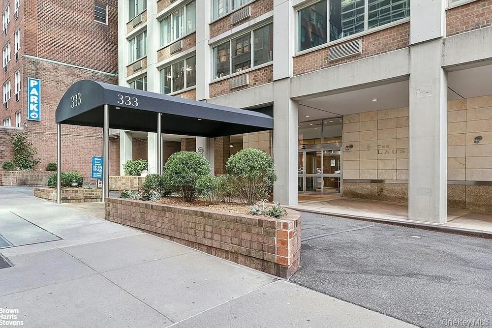 Entrance to property with brick siding