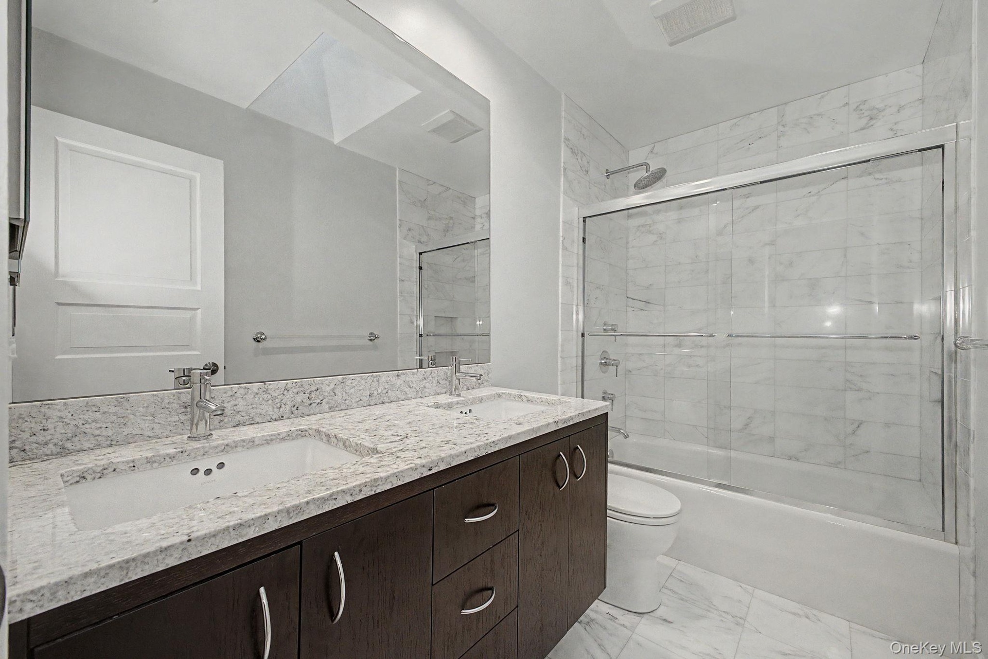 Skylight bathroom shared by two bedrooms.