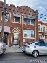 Brick facade with decorative arched entryway
