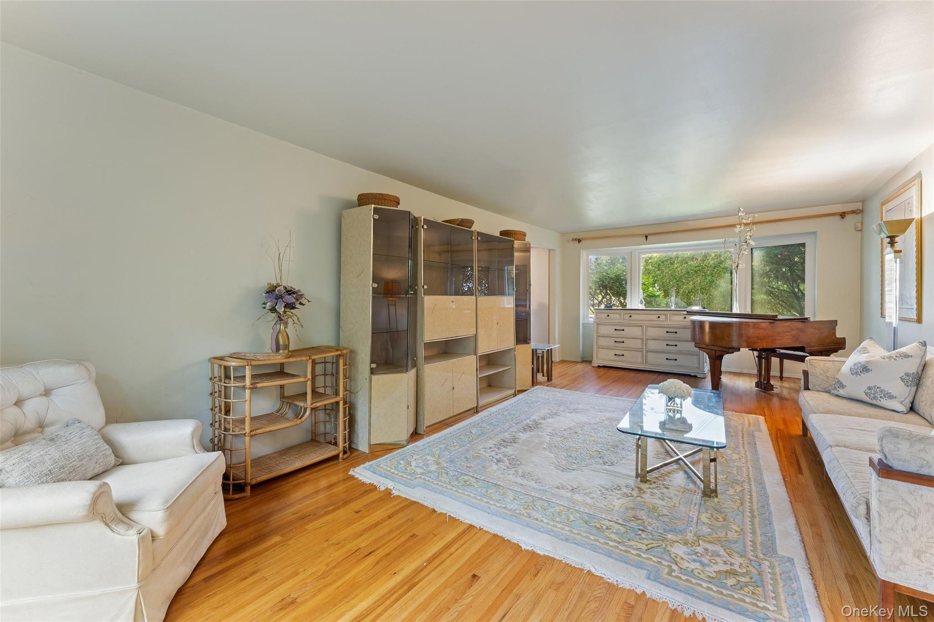 Hardwood flooring with expansive windows.