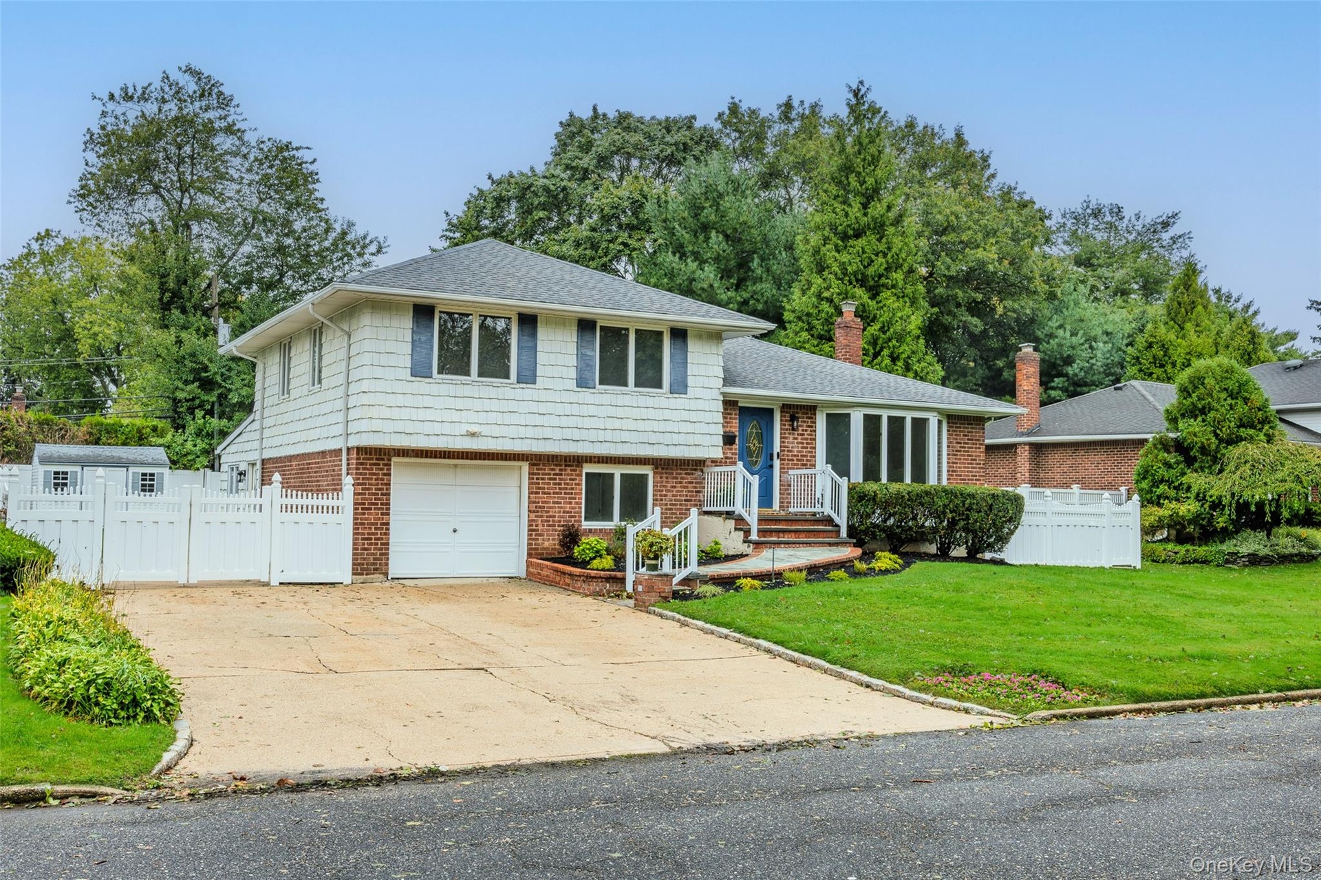 One Car Garage and expanded driveway w/ample parking.
