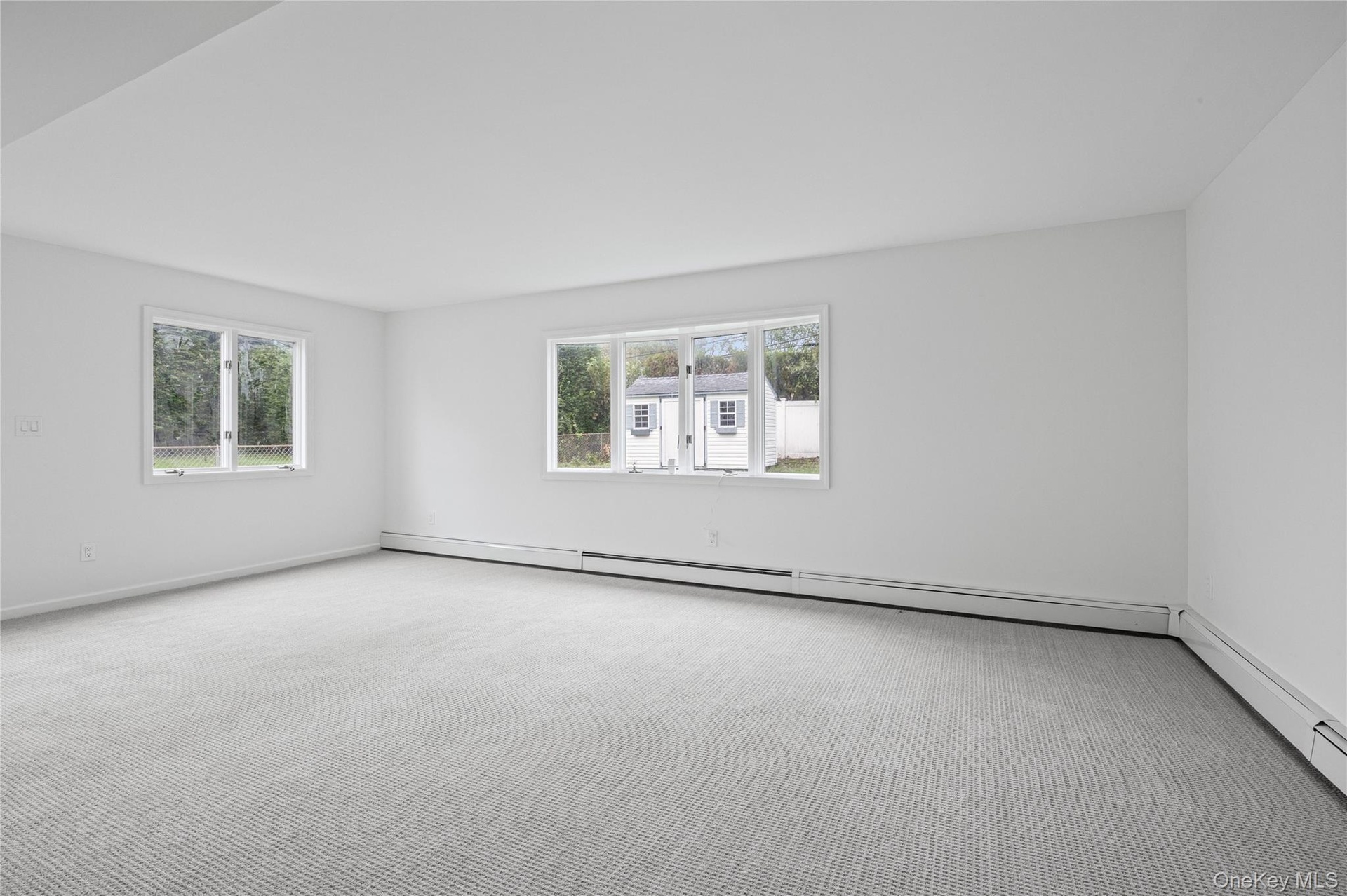 LOWER LEVELMany windows including a large bow make this lower level bright and welcoming!