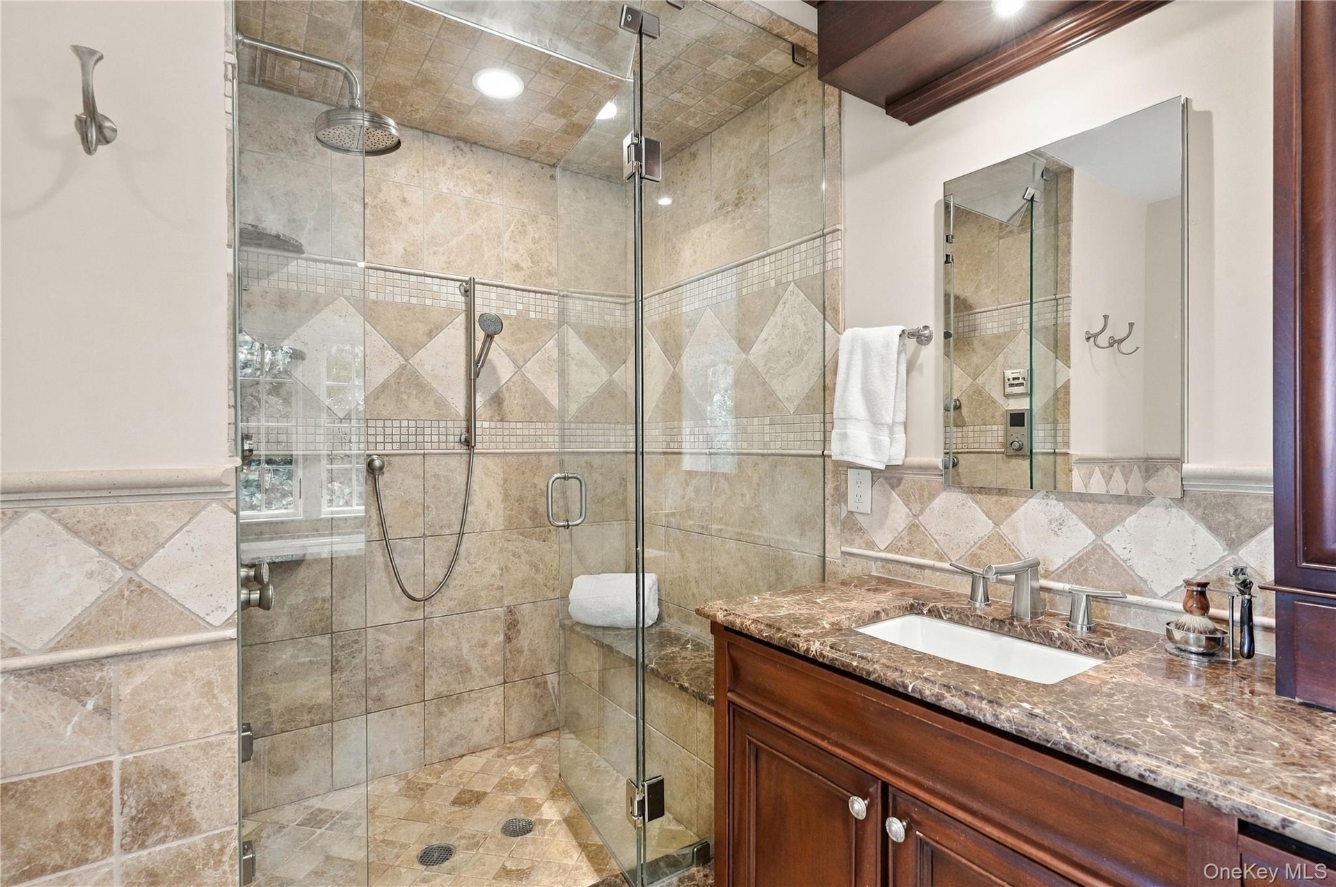 A luxurious steam shower featuring eight shower heads, custom controls, and elegant finishes for a true spa-like experience.