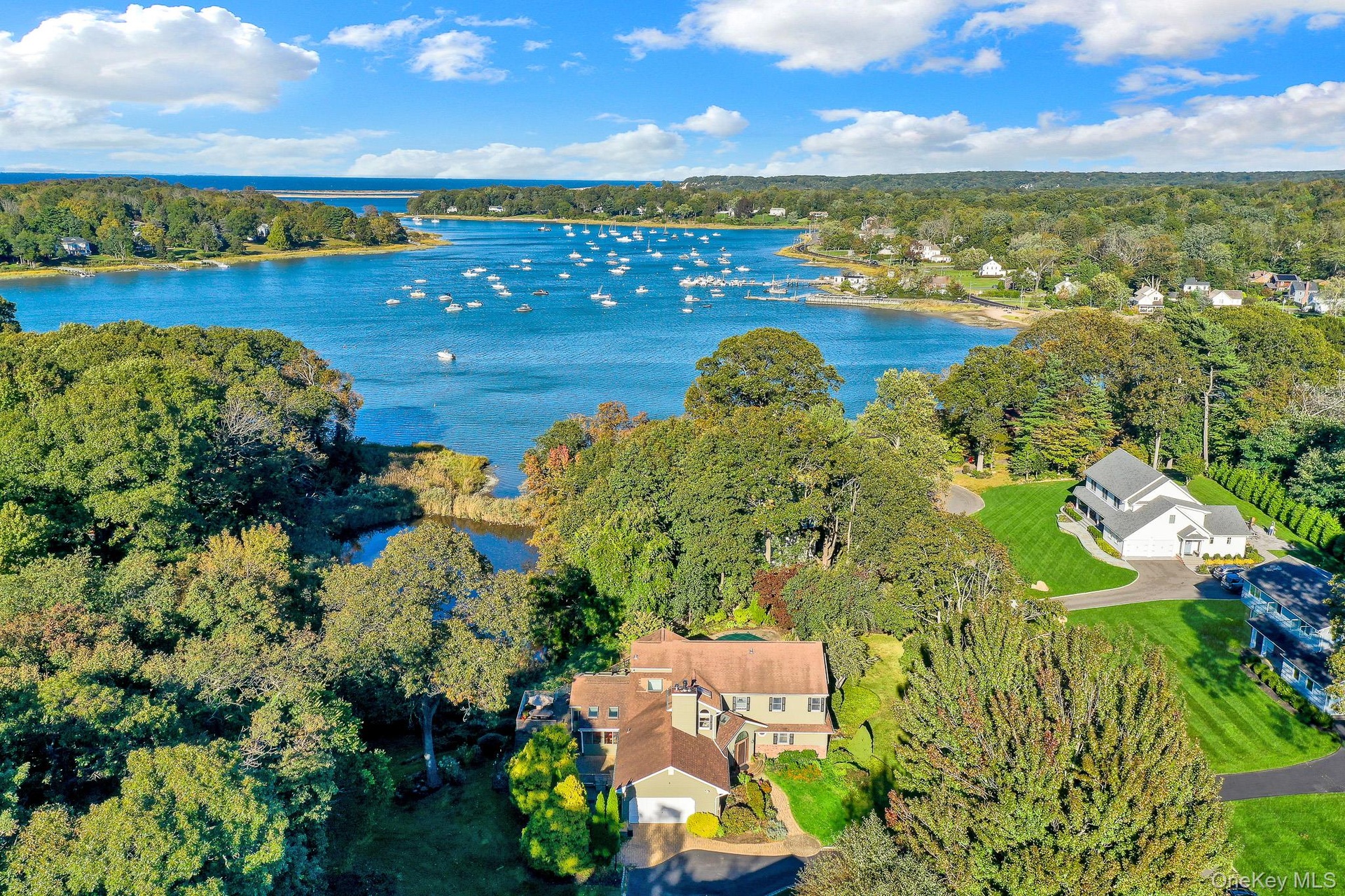 House in foreground with Setauket Harbor