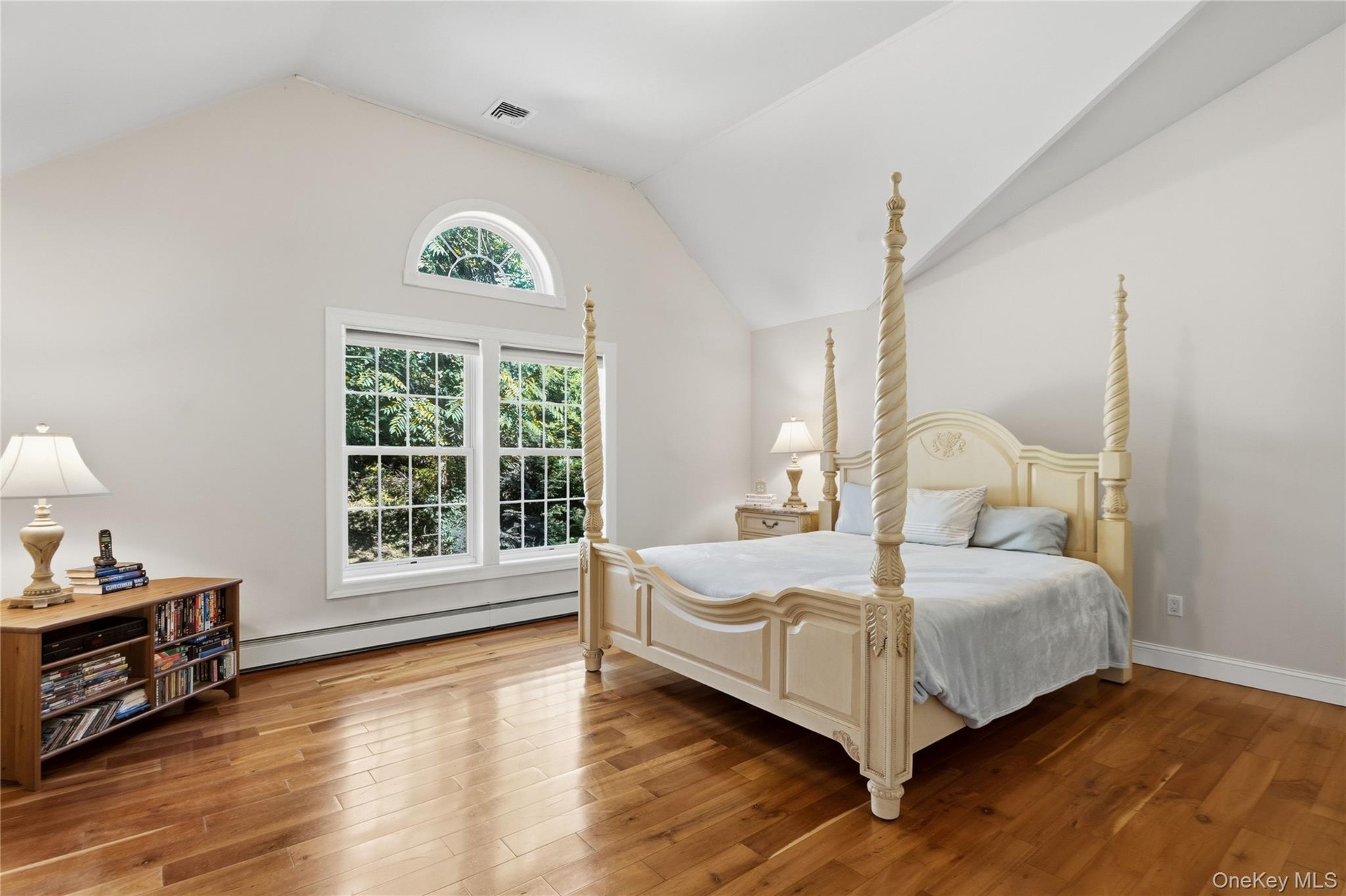 Principal suite with vaulted ceiling and two oversized walk-in closets