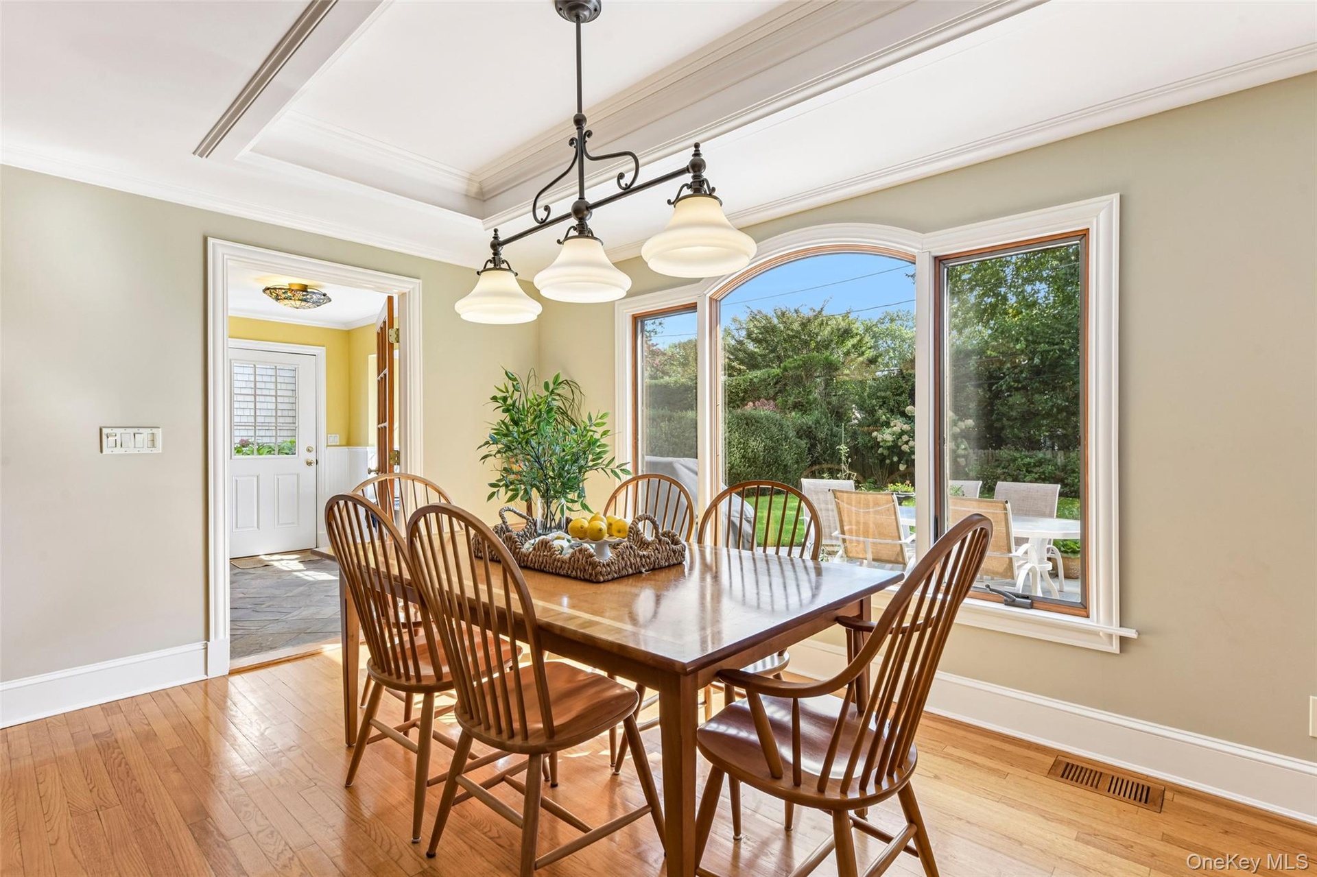 Dining area of eat-in kitchen accented by tray ceiling