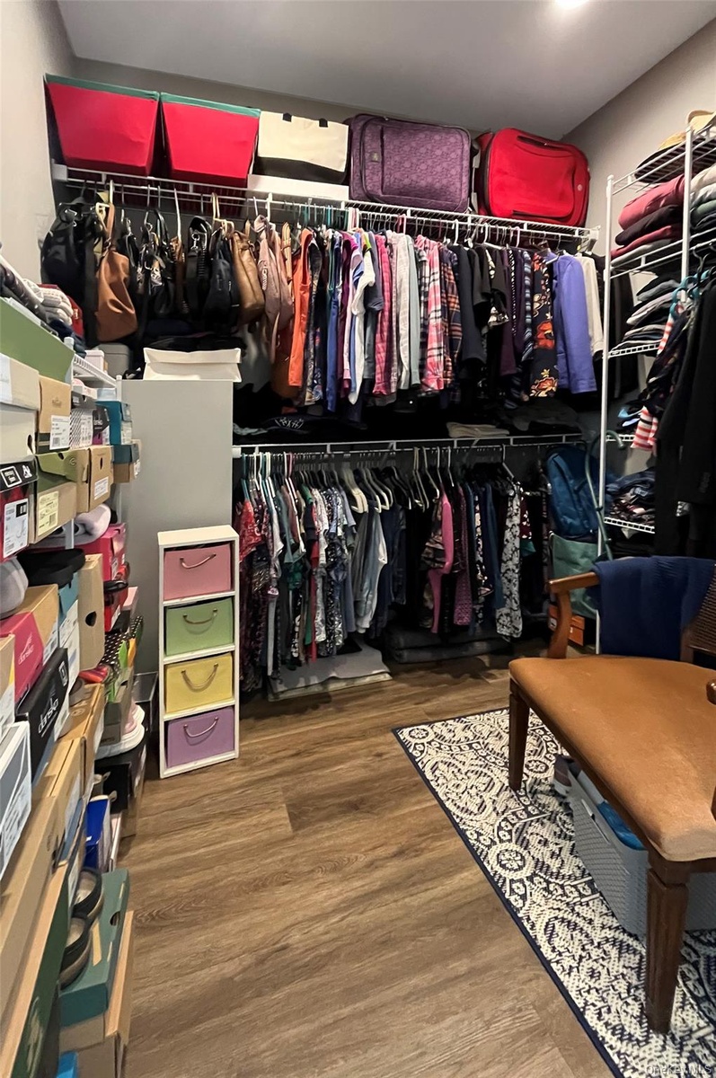 walk-in closet off of primary bedroom