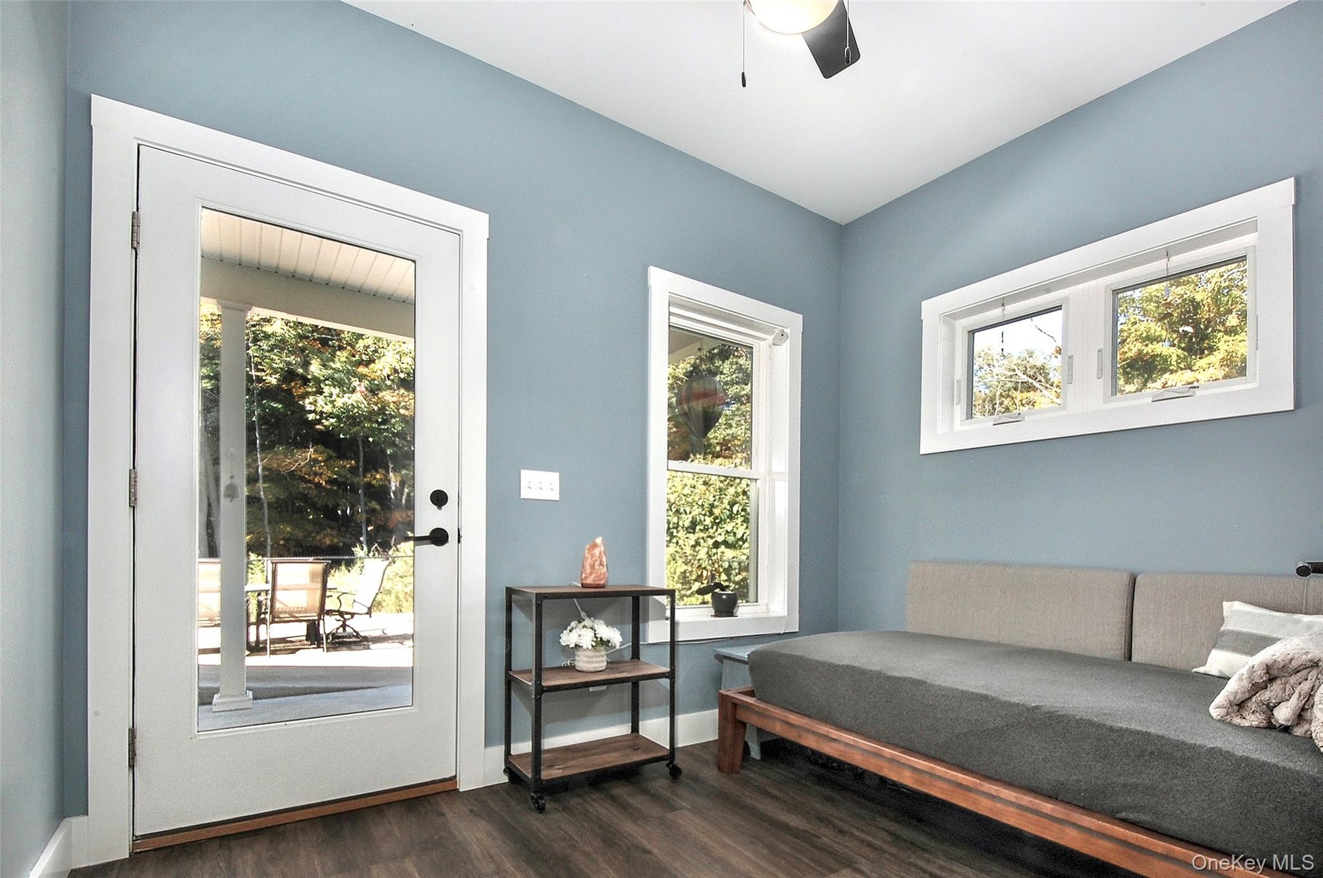 room off of kitchen with door leading to covered patio & backyard