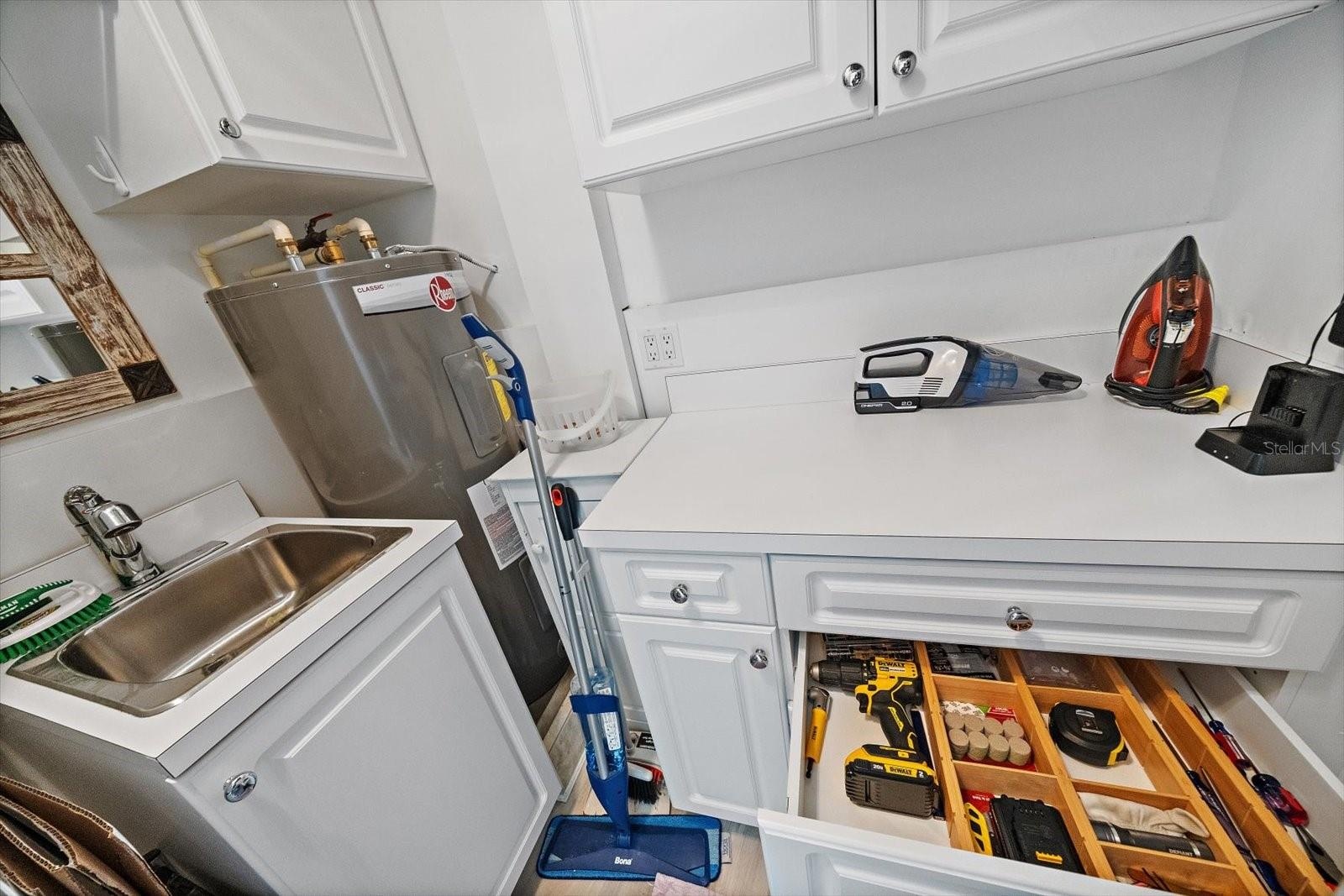 sink and extra storage in laundry