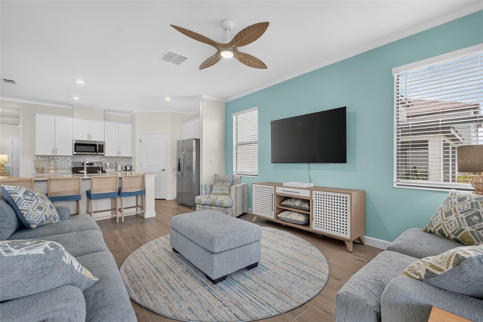 Living Room with large mounted T.V.
