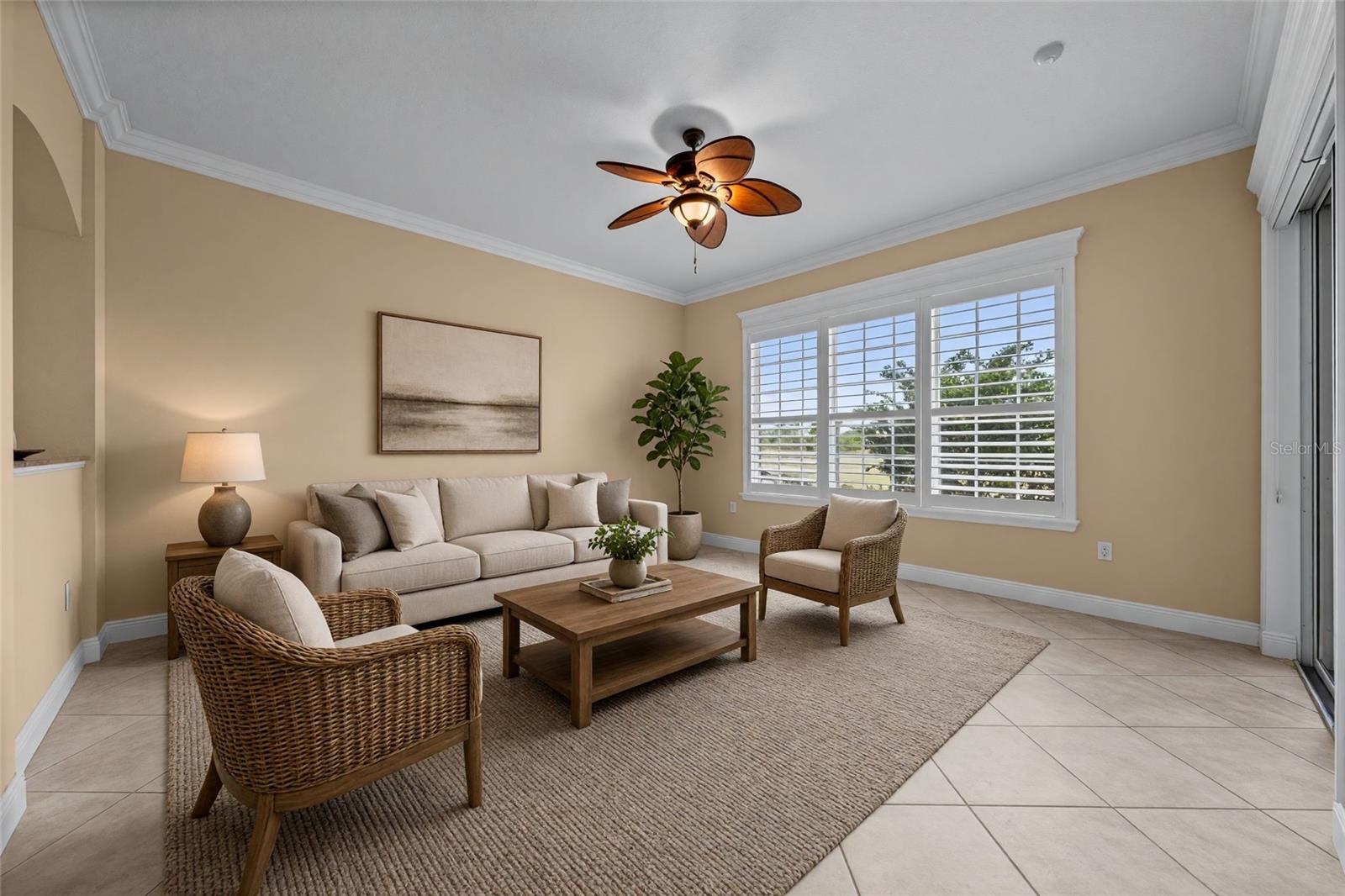 Just off the kitchen, this comfortable gathering space opens directly to the screened lanai.