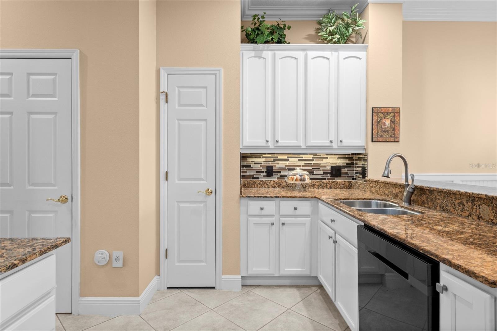 Plenty of cabinet space and a pantry keep kitchen essentials close at hand.