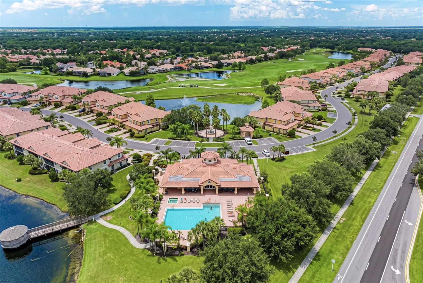A beautiful aerial look at Miramar’s lakes, golf course surroundings, and community pool.