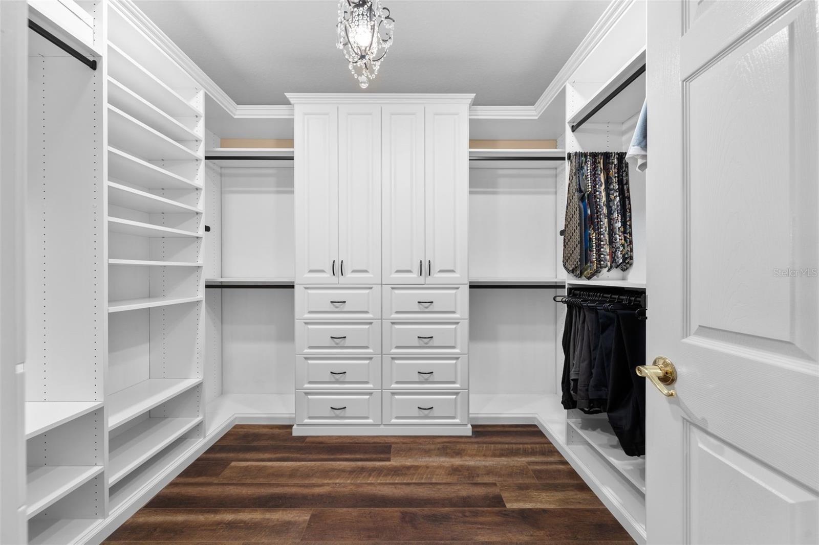 Keep everything organized with custom drawers, shelving, and generous hanging space in the walk-in closet.