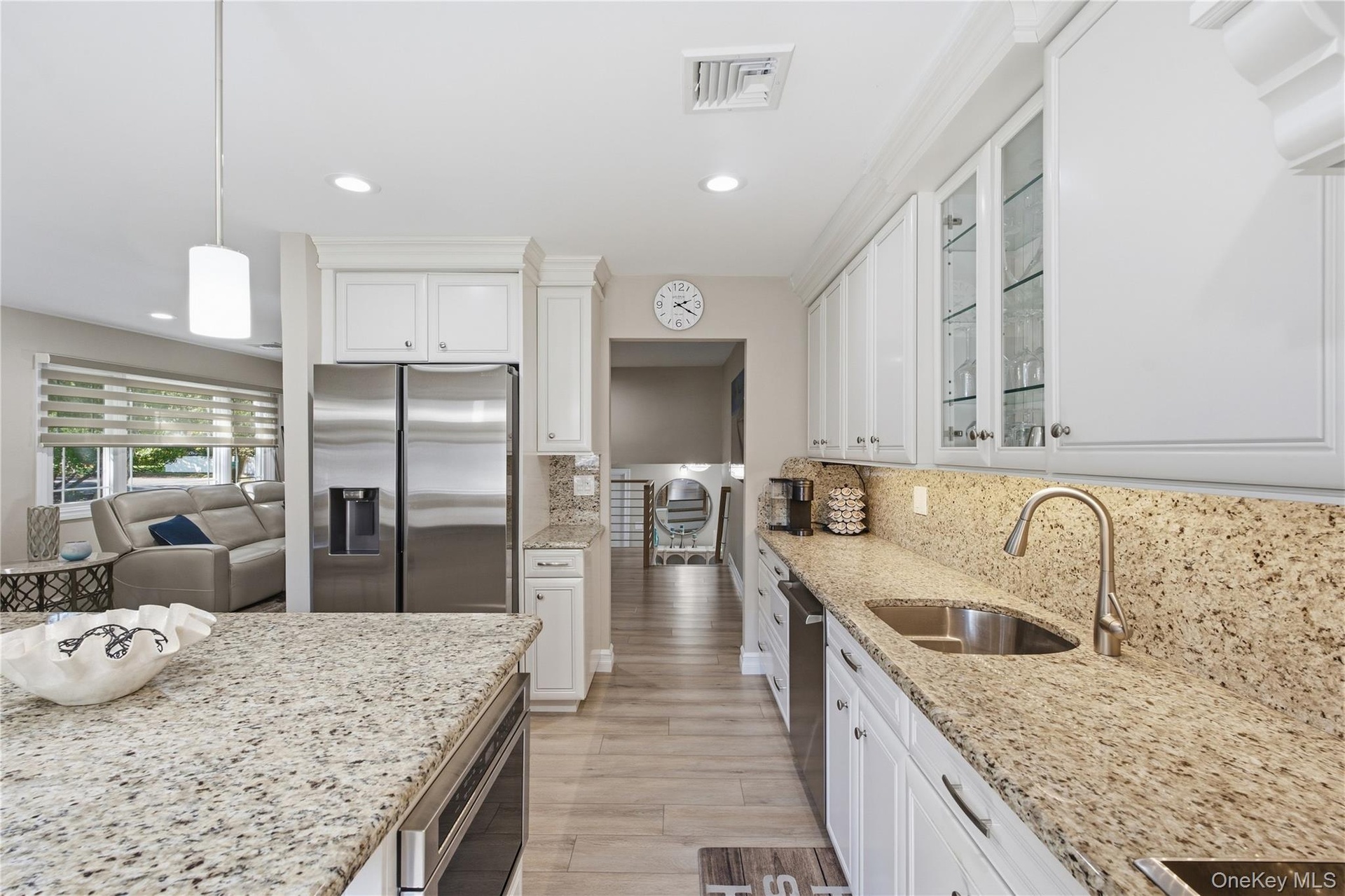 Updated kitchen with stainless steel appliances and granite countertops