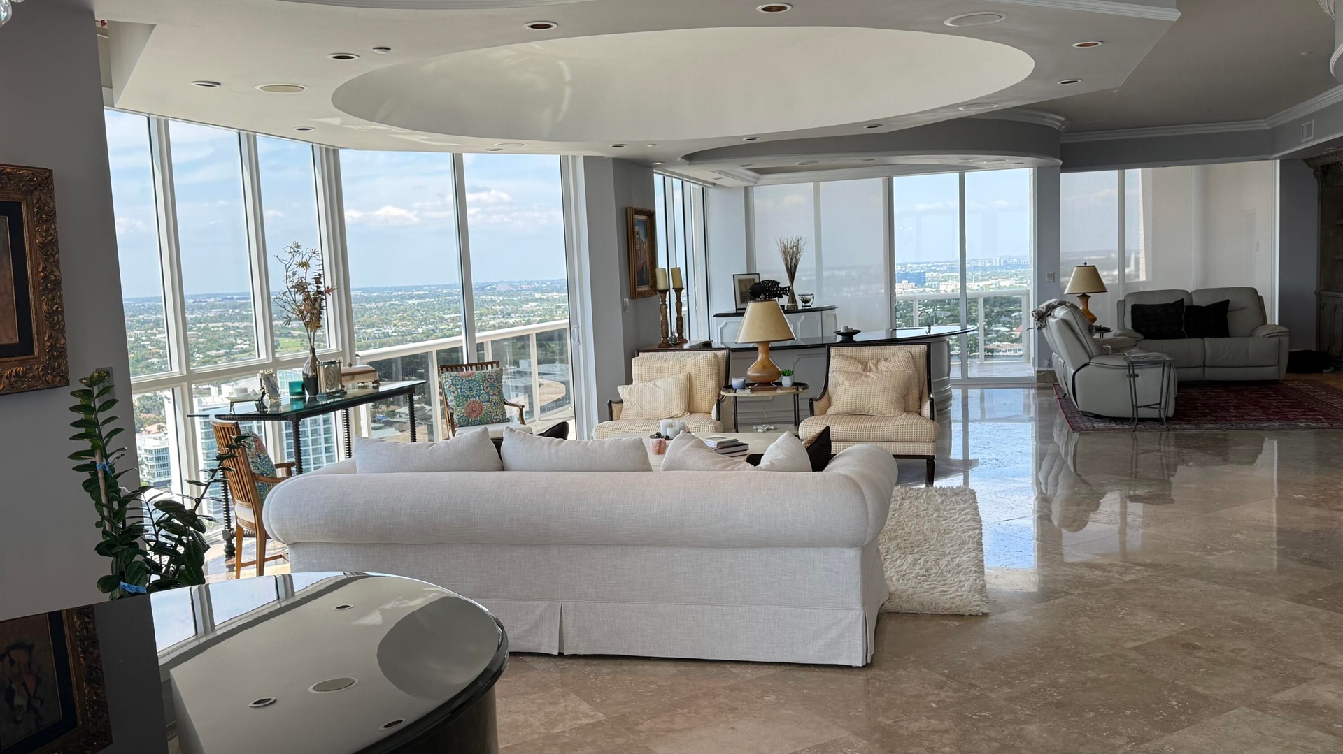 Living Room with bar on the end and media center on right.