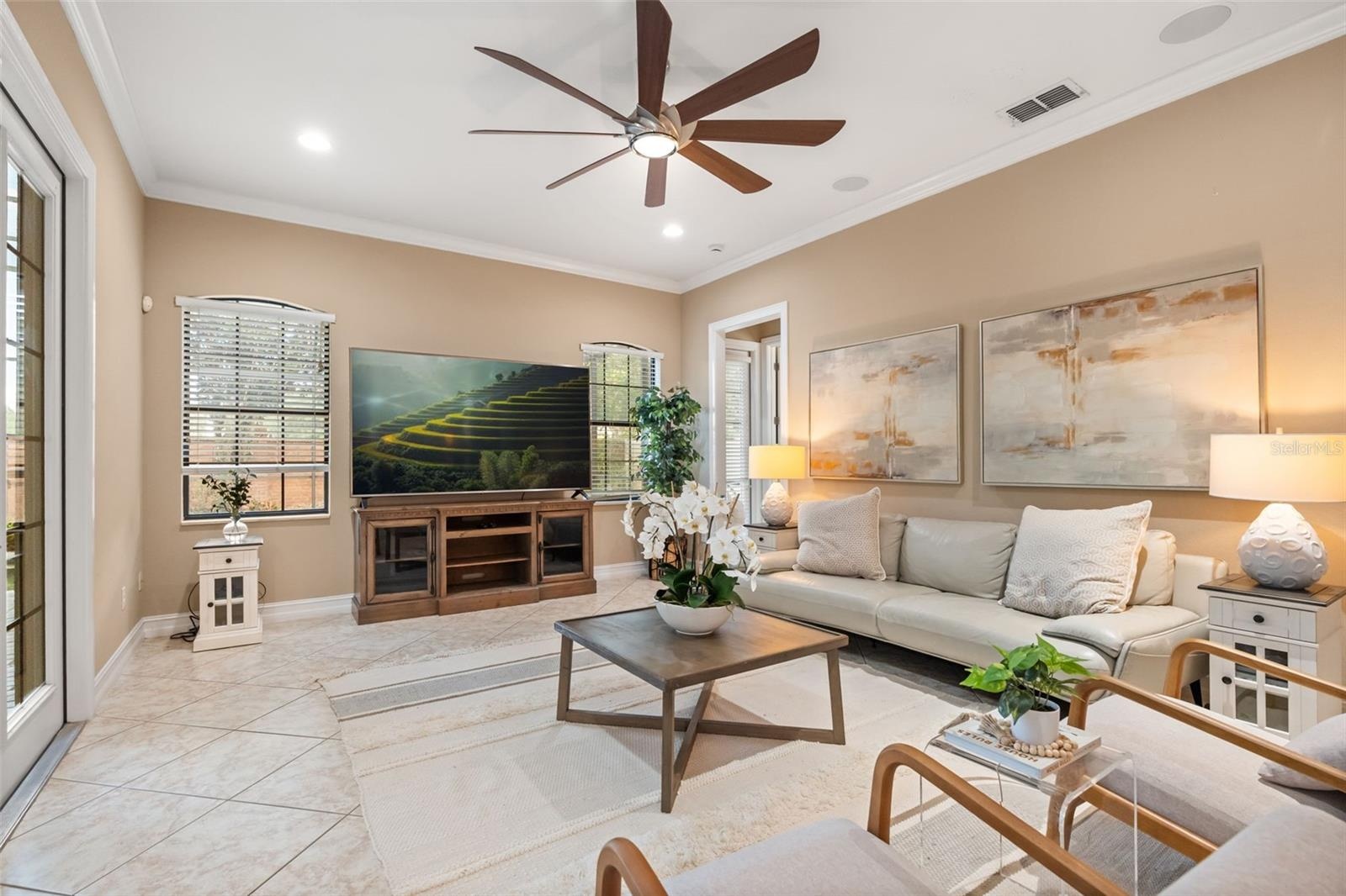 Family room leading to back downstairs guest bedroom and bathroom