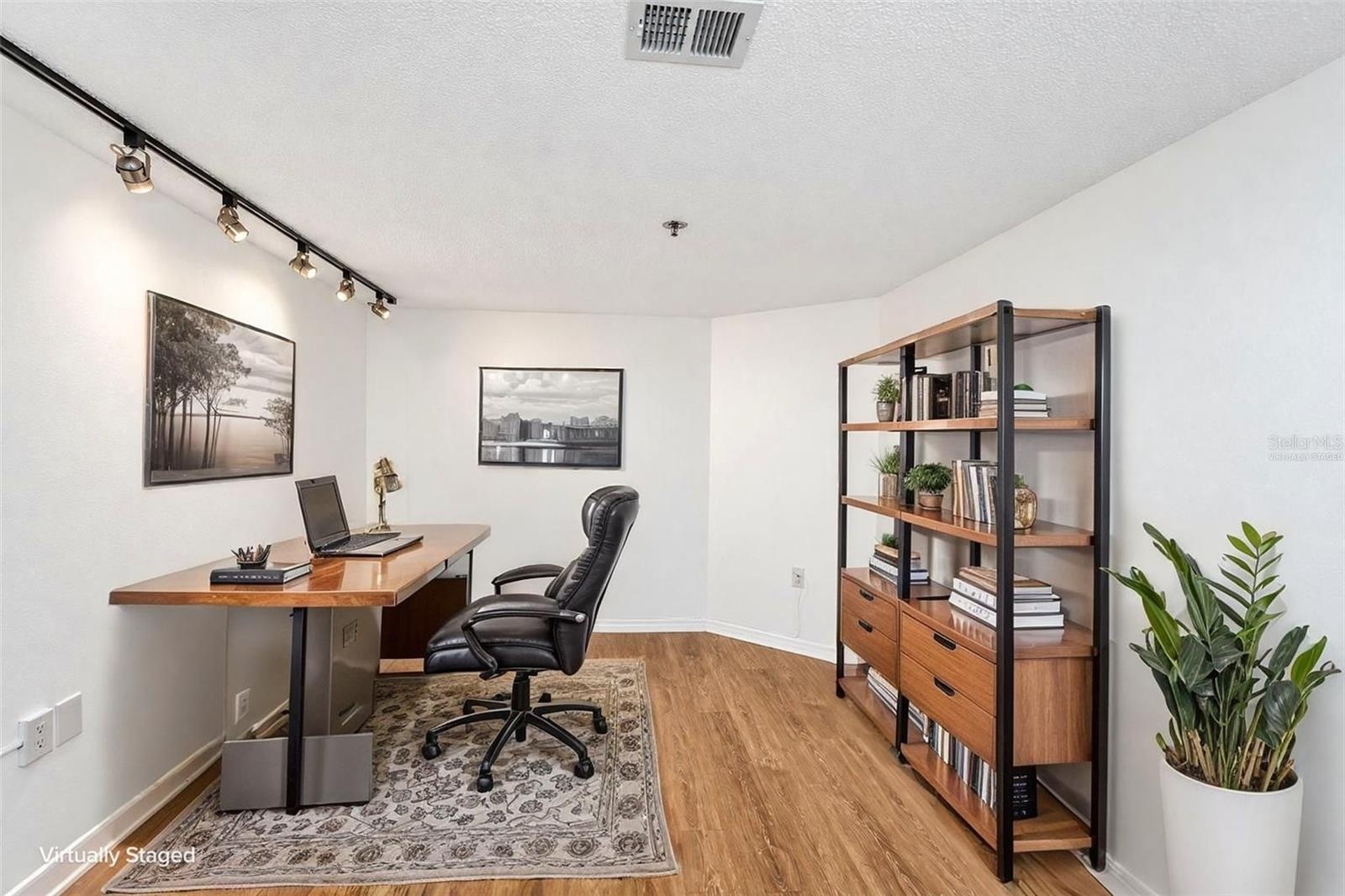 Option 1 for den = office furniture virtually staged