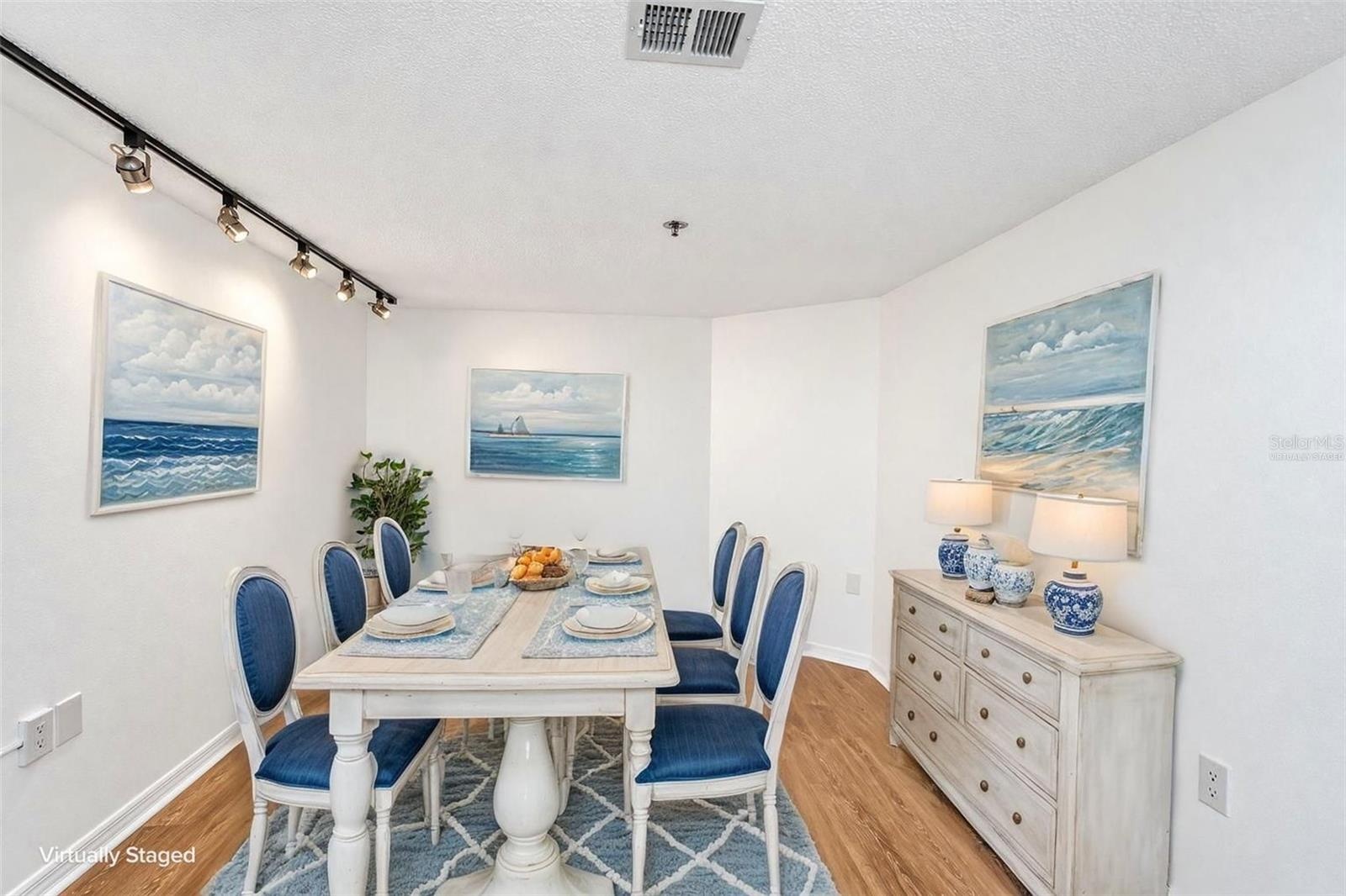 Option 2 for den = dining room furniture virtually staged