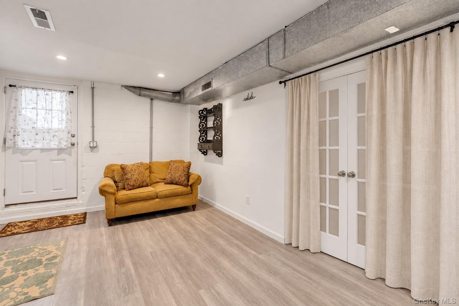 Virtually Edited Recreation Room with outside entrance.