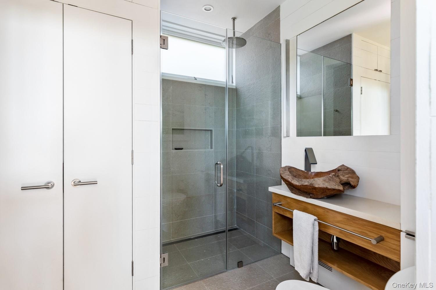 Second Bathroom on First Floor with Laundry and Storage