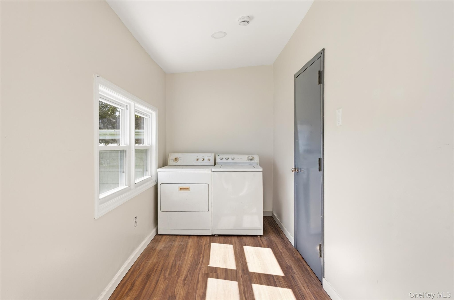 Main level laundry room and door to utility closet for gas burner