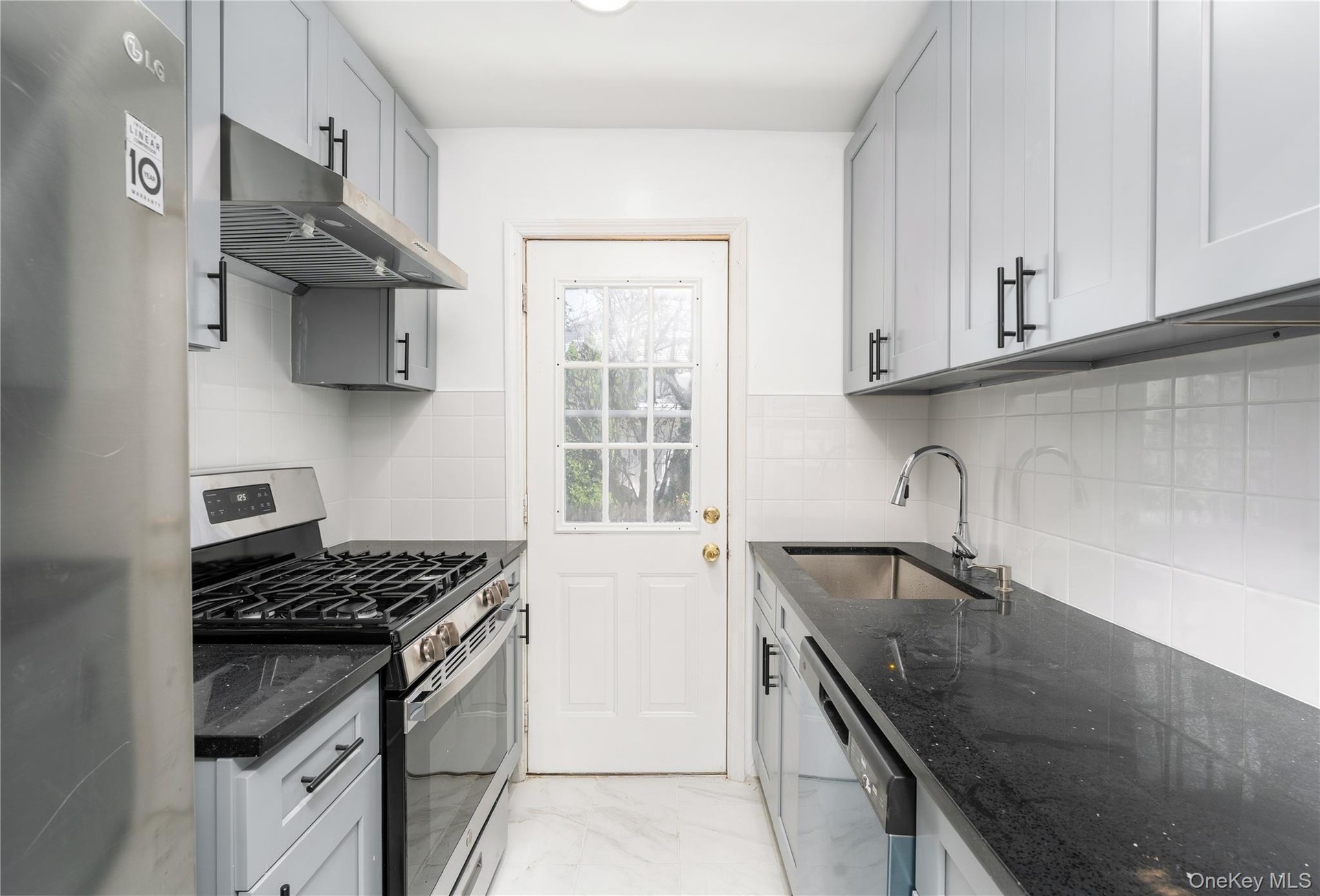 New Kitchen, SS appliances, sleek cabinetry extended height, stone counter tops, deep sink