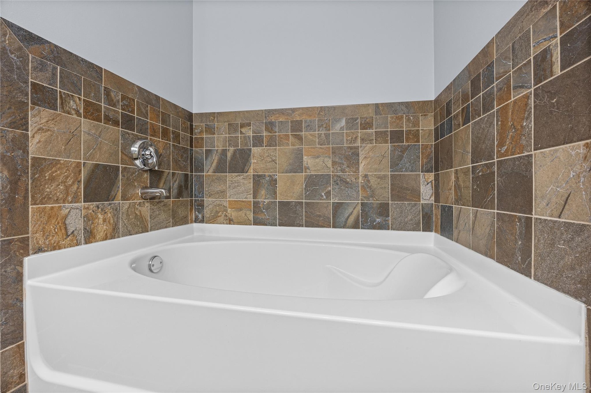 Corner Soaking Tub with Tile Surround