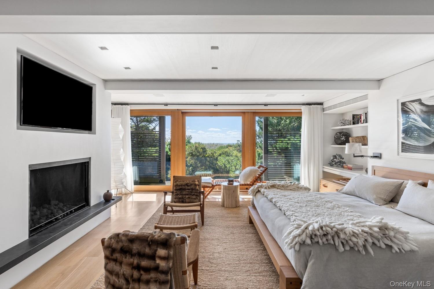 With gas fireplace, European oak hardwood floors and view of the ocean