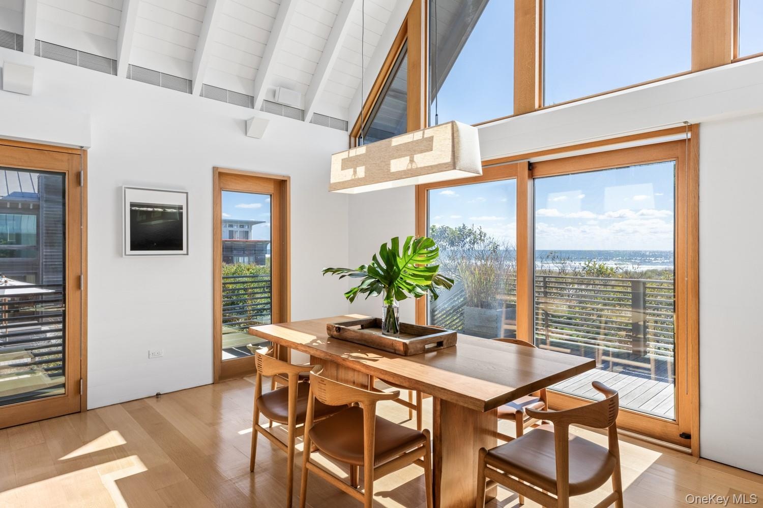 With dining area and sliding doors to 2nd story deck overlooking the ocean.