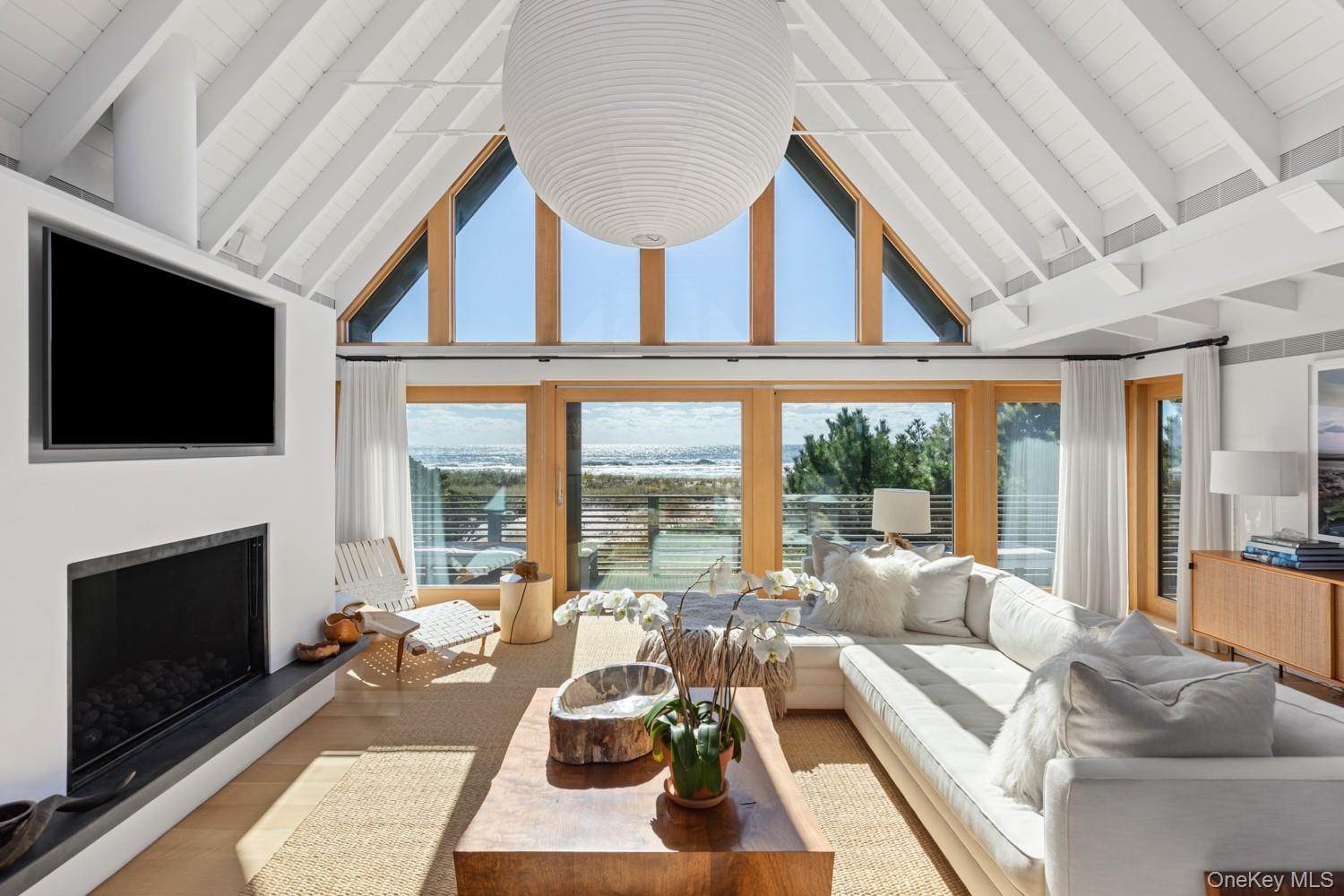 With exquiste view of the ocean. Hanging Noguchi light fixture.