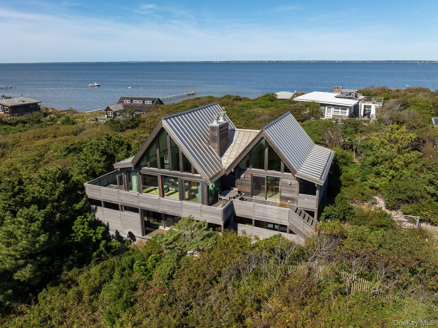 with custom made invarimate metal roof- and views of the bay.