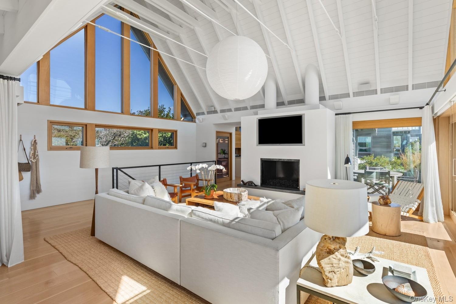 With Noguchi light fixture and view of the fireplace.