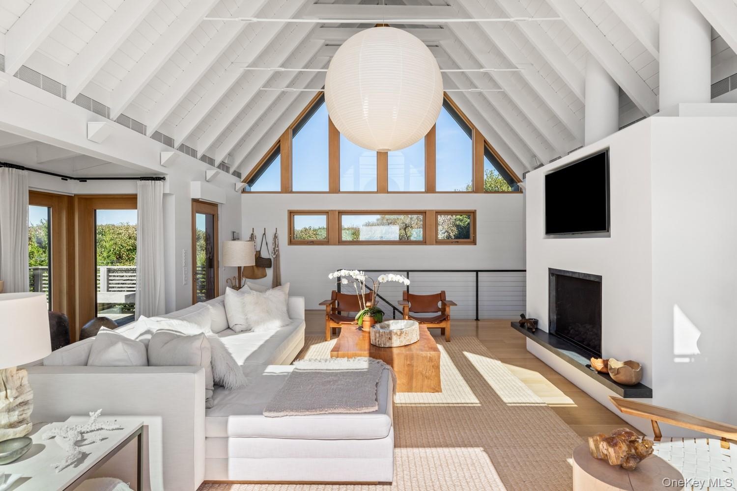 With view of the fireplace and Reilly windows at the back of the structure.
