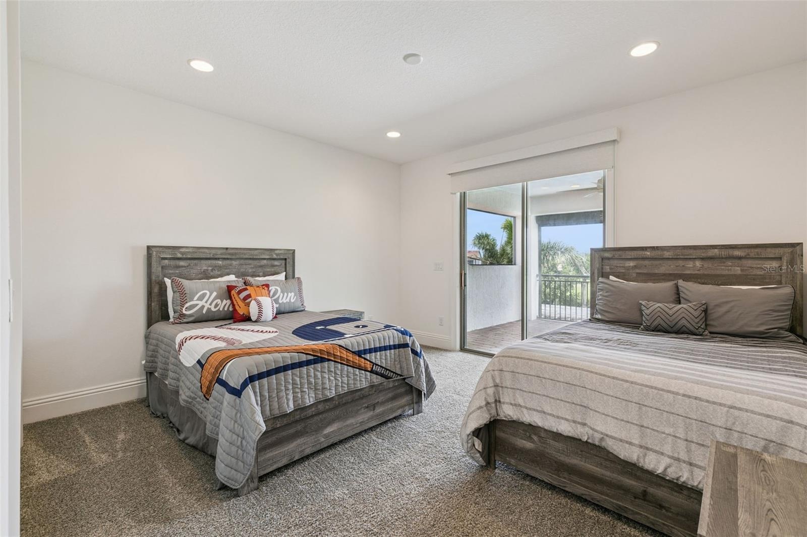 Bedroom 4 upstairs with ensuite bathroom and access to the balcony