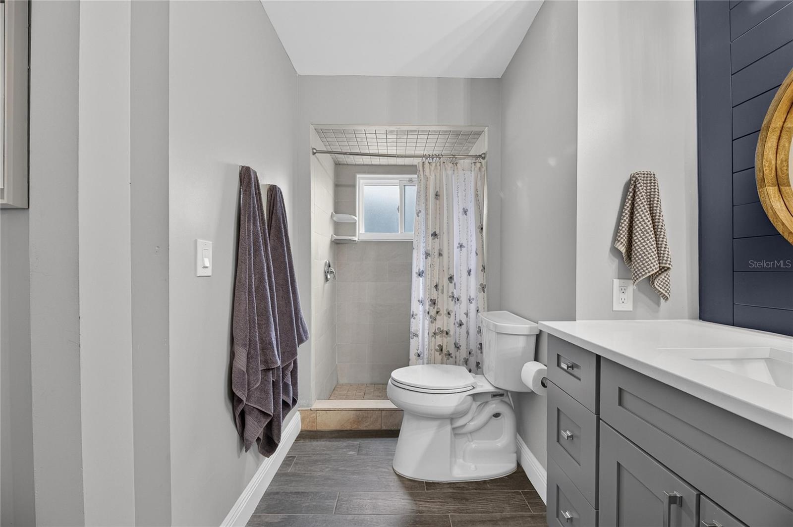 Also Features A Kohler Extended Height Commode, As Well As A Completely Tiled Top-To-Bottom Walk-In Shower!