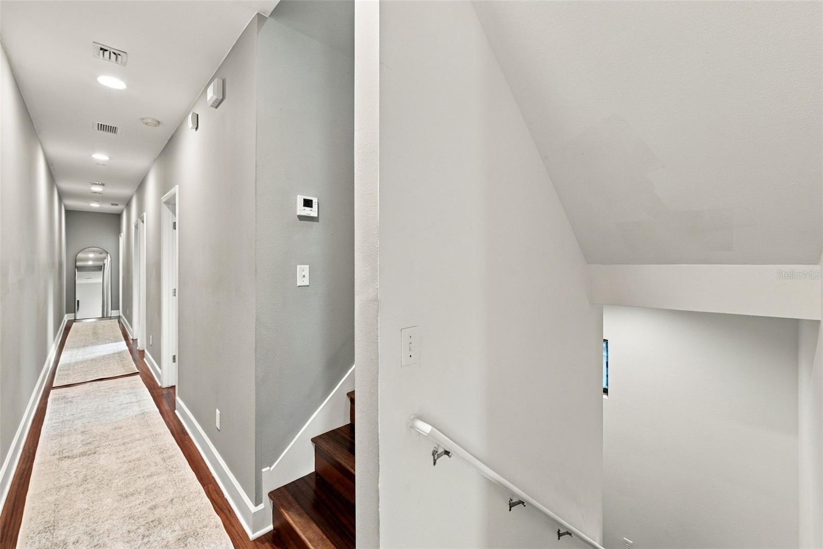 Down the hall are two secondary bedrooms and an office