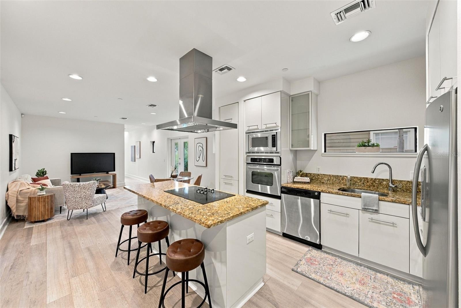 island and stainless steel appliances